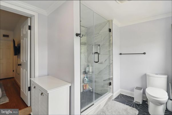 Bathroom, Glass Shower, Interior, Marble Walls, Wood Texture Flooring