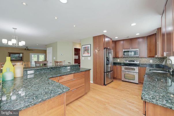 Chandelier, Dining room, Interior, Kitchen, Recessed Lighting, Stainless Steel Appliances, Wood Texture Flooring
