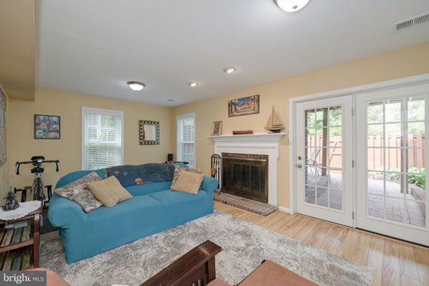 Fireplace, Fitness Equipment, Interior, Living room, Recessed Lighting, Wood Texture Flooring