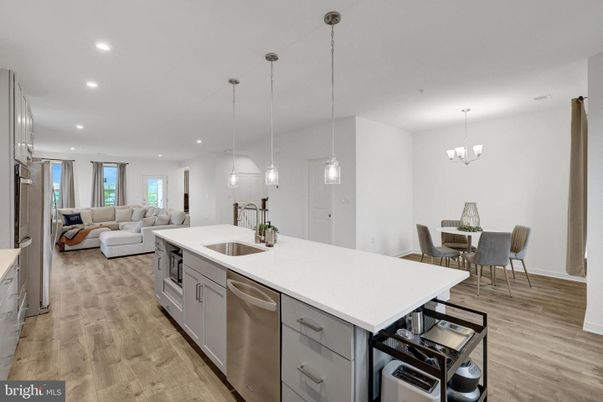 Chandelier, Dining room, Interior, Kitchen, Living room, Pendant Lights, Recessed Lighting, Stainless Steel Appliances, Wood Texture Flooring