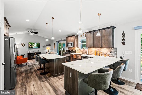 Fireplace, Interior, Kitchen, Living room, Pendant Lights, Recessed Lighting, Stainless Steel Appliances, Wood Texture Flooring