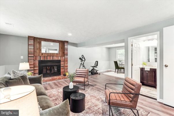 Fireplace, Fitness Equipment, Interior, Living room, Recessed Lighting, Wood Texture Flooring