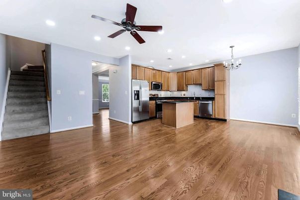 Chandelier, Empty room, Interior, Kitchen, Recessed Lighting, Stainless Steel Appliances, Wood Texture Flooring