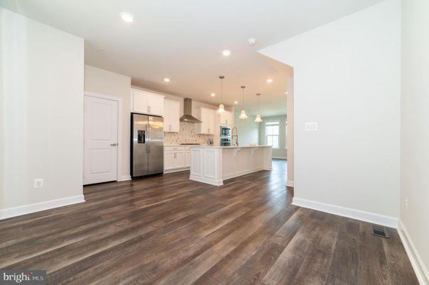 Empty room, Interior, Kitchen, Pendant Lights, Recessed Lighting, Stainless Steel Appliances, Wood Texture Flooring