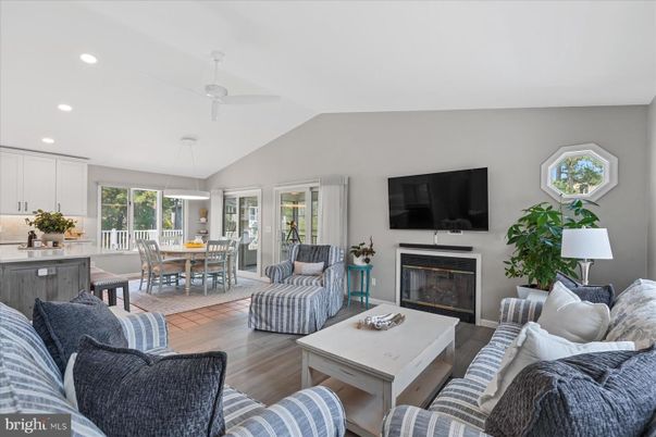 Dining room, Fireplace, Interior, Living room, Pendant Lights, Recessed Lighting, Wood Texture Flooring