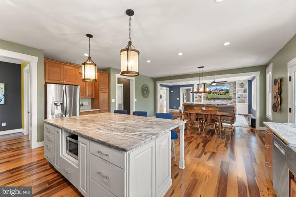 Dining room, Interior, Kitchen, Pendant Lights, Recessed Lighting, Stainless Steel Appliances, Wood Texture Flooring