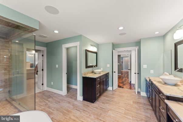 Bathroom, Dual Sink Vanities, Glass Shower, Interior, Recessed Lighting, Wood Texture Flooring