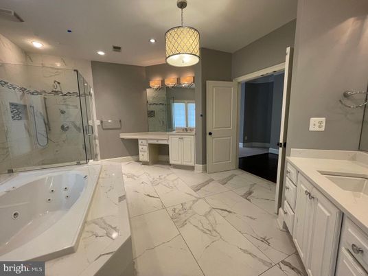 Bathroom, Dual Sink Vanities, Glass Shower, Interior, Marble, Marble Walls, Recessed Lighting