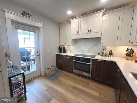 Interior, Kitchen, Marble Walls, Recessed Lighting, Wood Texture Flooring