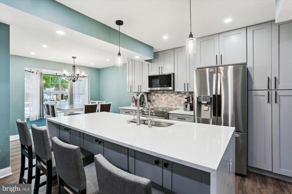 Chandelier, Interior, Kitchen, Pendant Lights, Recessed Lighting, Stainless Steel Appliances, Wood Texture Flooring