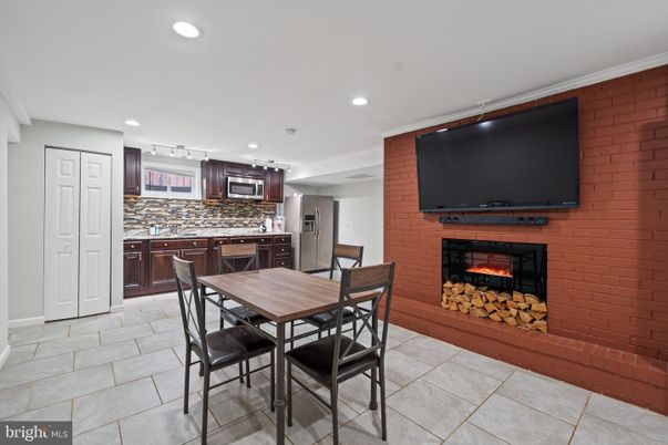 Dining room, Fireplace, Interior, Kitchen, Recessed Lighting, Stainless Steel Appliances, Stone Walls