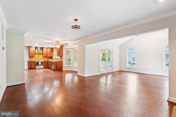 Empty room, Interior, Kitchen, Recessed Lighting, Stainless Steel Appliances, Wood Texture Flooring