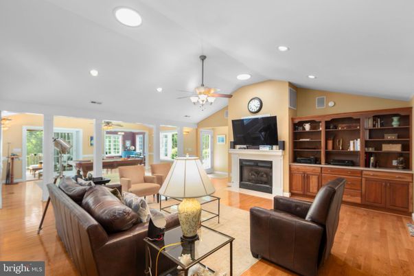 Billiard Table, Fireplace, Game Room, Interior, Living room, Recessed Lighting, Wood Texture Flooring