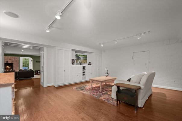 Fireplace, Interior, Living room, Recessed Lighting, Stone Walls, Wood Texture Flooring
