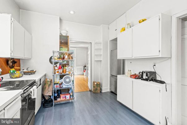 Interior, Kitchen, Recessed Lighting, Washer, Wood Texture Flooring
