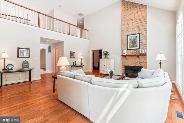 Fireplace, Interior, Living room, Recessed Lighting, Stone Walls, Wood Texture Flooring