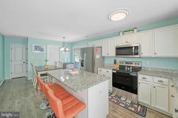 Dining room, Interior, Kitchen, Pendant Lights, Stainless Steel Appliances, Wood Texture Flooring