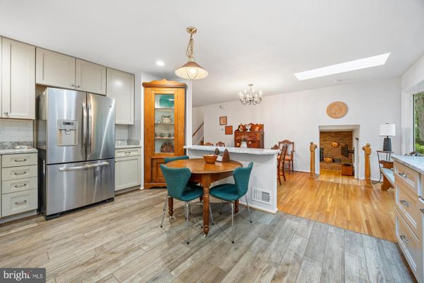 Chandelier, Dining room, Interior, Kitchen, Recessed Lighting, Stainless Steel Appliances, Wood Texture Flooring