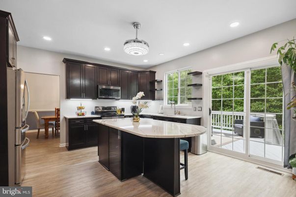 Chandelier, Interior, Kitchen, Recessed Lighting, Stainless Steel Appliances, Wood Texture Flooring