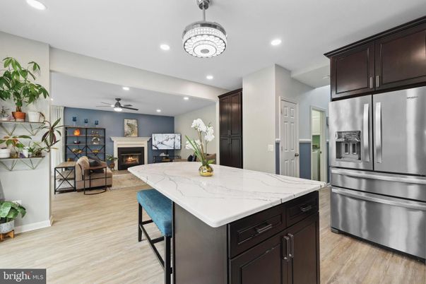 Fireplace, Interior, Kitchen, Living room, Recessed Lighting, Stainless Steel Appliances, Wood Texture Flooring