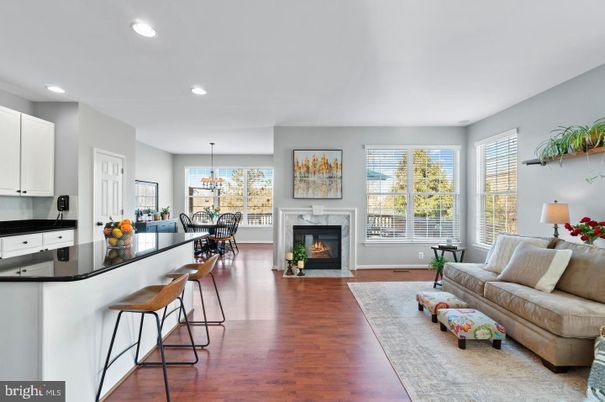 Chandelier, Dining room, Fireplace, Interior, Living room, Pendant Lights, Recessed Lighting, Wood Texture Flooring