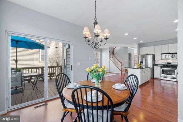 Chandelier, Dining room, Interior, Kitchen, Recessed Lighting, Stainless Steel Appliances, Wood Texture Flooring