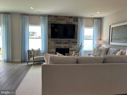 Fireplace, Interior, Living room, Recessed Lighting, Stone Walls, Wood Texture Flooring