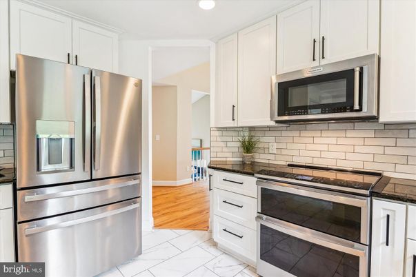 Interior, Kitchen, Marble, Recessed Lighting, Stainless Steel Appliances, Wood Texture Flooring