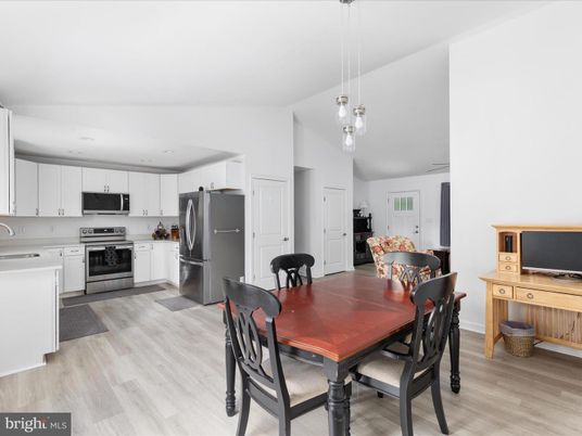 Dining room, Interior, Kitchen, Pendant Lights, Recessed Lighting, Stainless Steel Appliances, Wood Texture Flooring