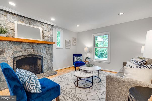 Fireplace, Interior, Living room, Recessed Lighting, Stone Walls, Wood Texture Flooring