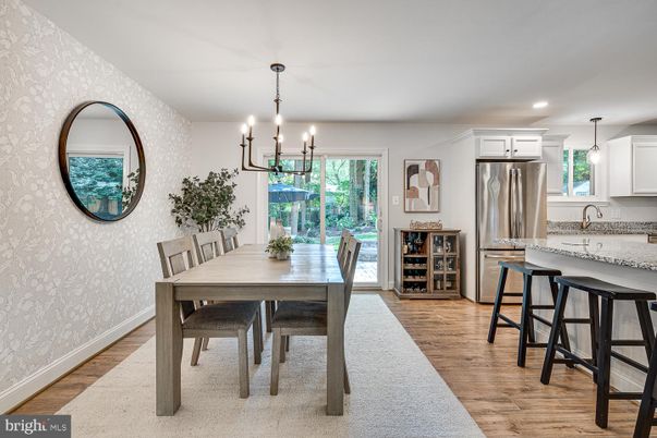 Chandelier, Dining room, Interior, Kitchen, Pendant Lights, Recessed Lighting, Stainless Steel Appliances, Wood Texture Flooring