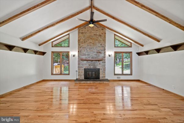 Empty room, Fireplace, Interior, Stone Walls, Wooden Beams, Wood Texture Flooring
