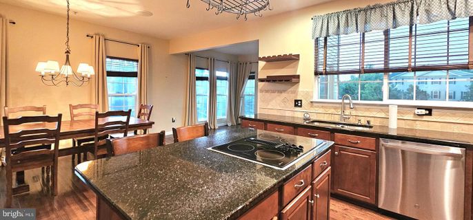 Dining room, Interior, Kitchen, Pendant Lights, Stainless Steel Appliances, Wood Texture Flooring
