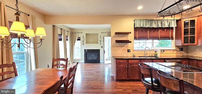 Dining room, Fireplace, Interior, Kitchen, Recessed Lighting, Wood Texture Flooring