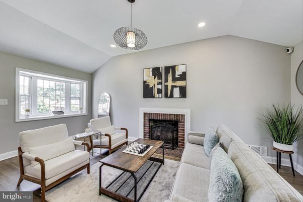 Dining room, Fireplace, Interior, Living room, Pendant Lights, Recessed Lighting, Wood Texture Flooring