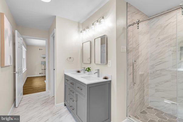 Bathroom, Dual Sink Vanities, Glass Shower, Interior, Marble, Marble Walls, Wood Texture Flooring