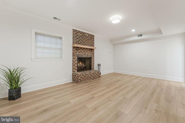 Empty room, Fireplace, Interior, Recessed Lighting, Stone Walls, Wood Texture Flooring