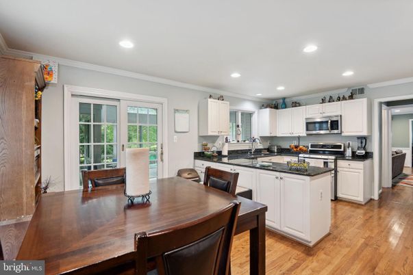 Dining room, Interior, Kitchen, Recessed Lighting, Stainless Steel Appliances, Wood Texture Flooring