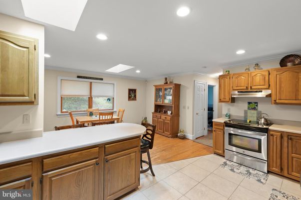 Dining room, Interior, Kitchen, Recessed Lighting, Stainless Steel Appliances, Wood Texture Flooring