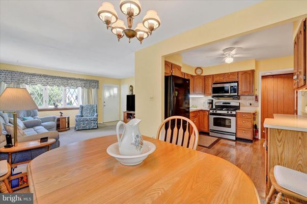 Chandelier, Dining room, Interior, Kitchen, Living room, Stainless Steel Appliances, Wood Texture Flooring