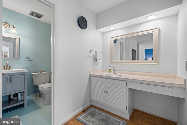Bathroom, Dual Sink Vanities, Interior, Recessed Lighting, Wood Texture Flooring