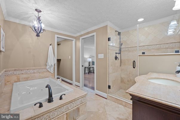 Bathroom, Chandelier, Glass Shower, Interior, Recessed Lighting, Wood Texture Flooring
