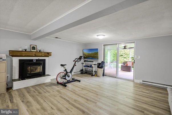 Fireplace, Fitness Equipment, Interior, Wood Texture Flooring