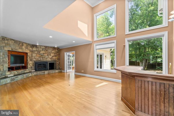Empty room, Fireplace, Interior, Recessed Lighting, Stone Walls, Wood Texture Flooring