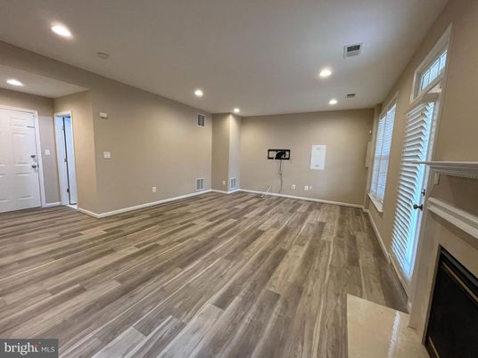 Empty room, Fireplace, Fitness Equipment, Interior, Recessed Lighting, Wood Texture Flooring