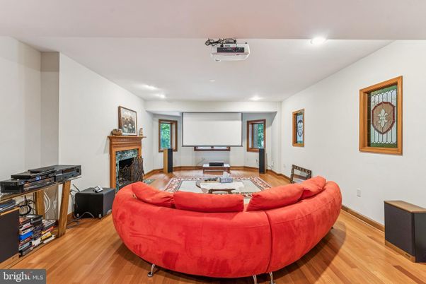 Fireplace, Interior, Projection Screen, Recessed Lighting, Wood Texture Flooring