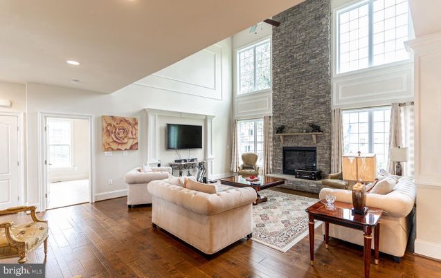 Fireplace, Interior, Living room, Recessed Lighting, Stone Walls, Wood Texture Flooring