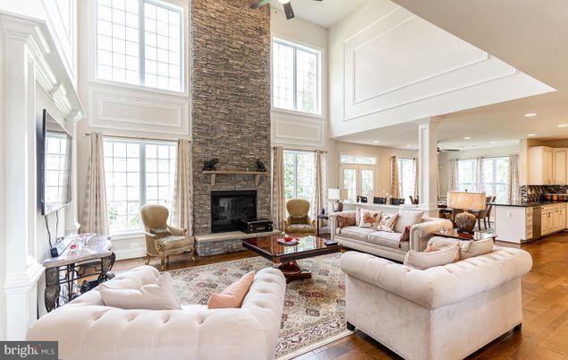 Fireplace, Interior, Living room, Recessed Lighting, Stone Walls, Wood Texture Flooring