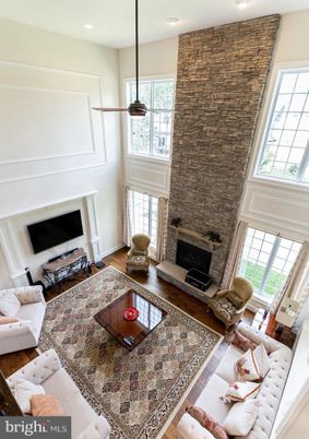 Fireplace, Interior, Living room, Recessed Lighting, Stone Walls, Wood Texture Flooring