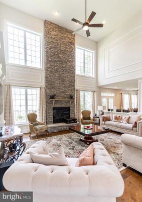 Fireplace, Interior, Living room, Recessed Lighting, Stone Walls, Wood Texture Flooring